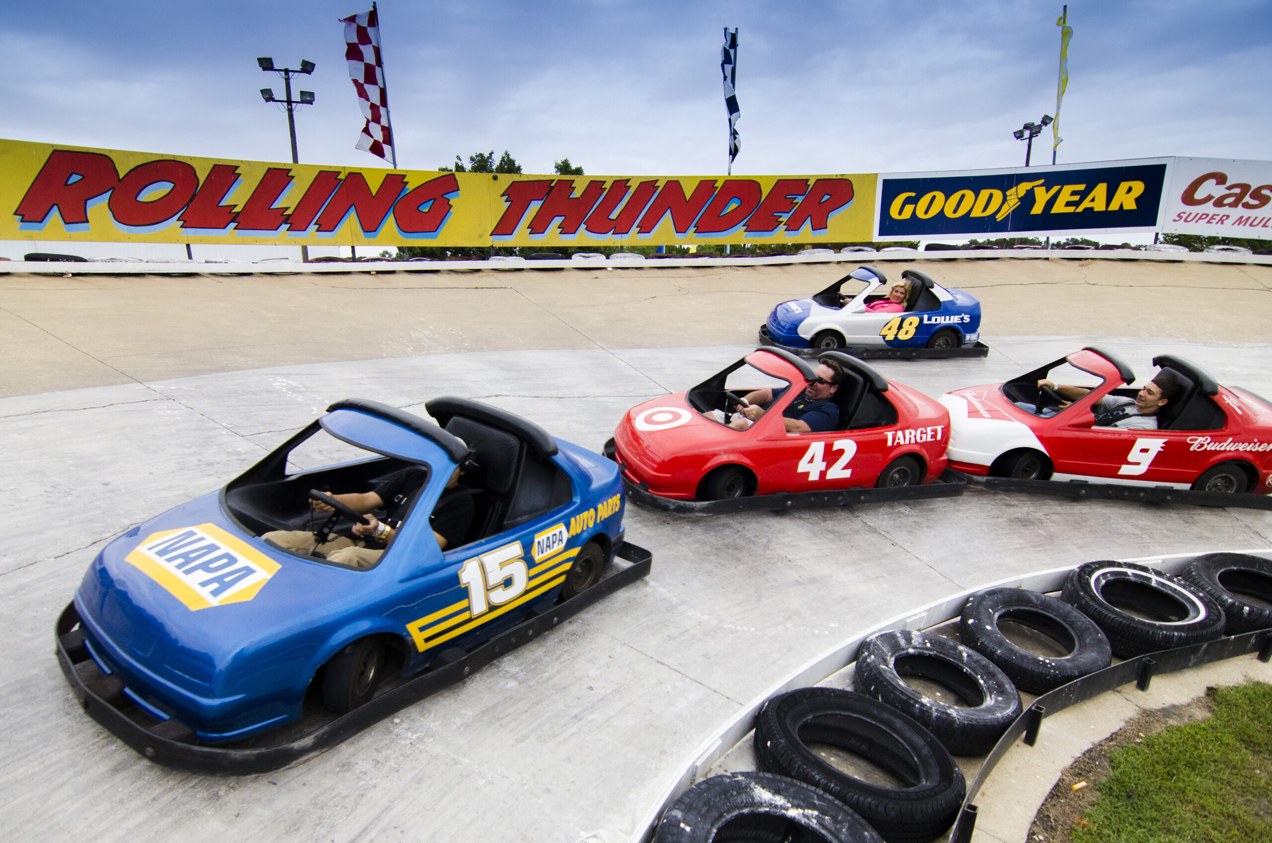 4 go-kart drivers racing on the Stock Cars Track at Baja Amusements: Ocean City Go-Karts.